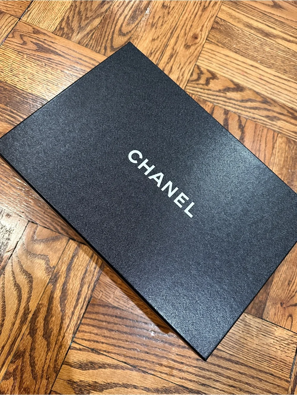 CHANEL Black Leather Logo Thong Sandals with Gold Accent